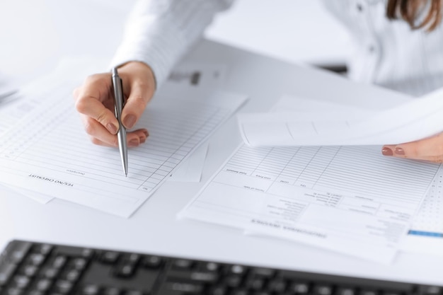 picture of woman hand filling in blank paper or document