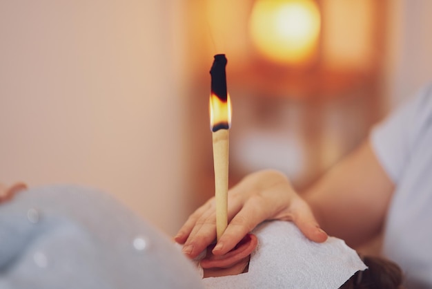 Picture of woman having candle therapy concha