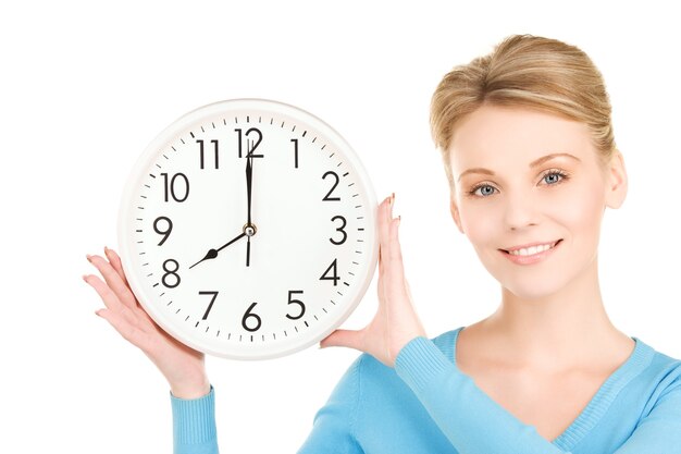 picture of woman holding big clock over white