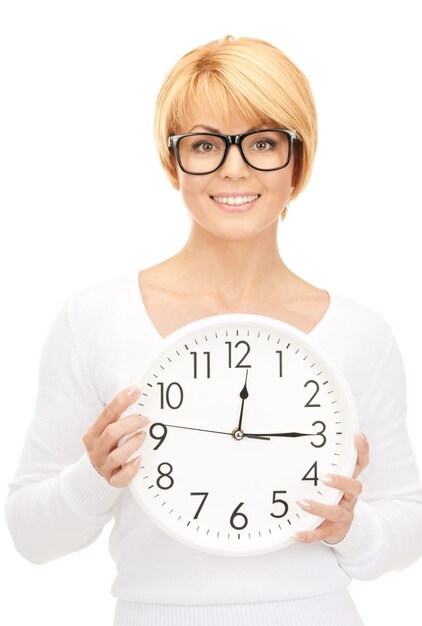 picture of woman holding big clock over white