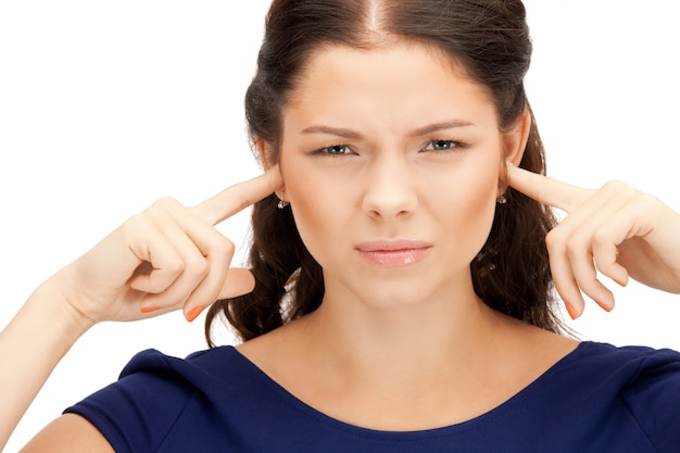 picture of woman with fingers in ears