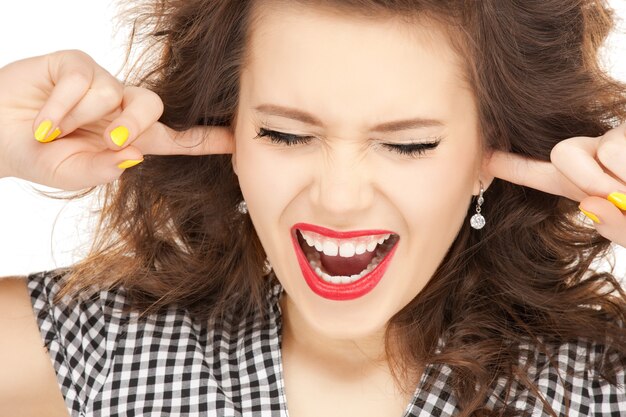 picture of woman with fingers in ears