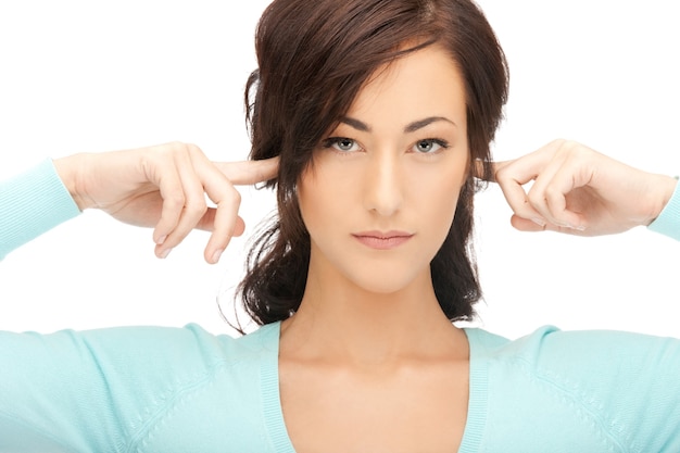 picture of woman with fingers in ears