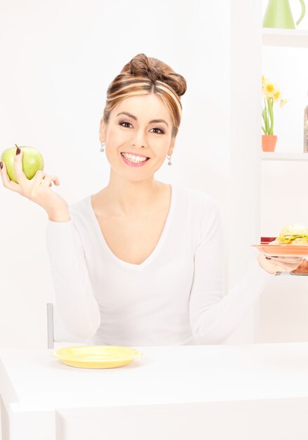 picture of woman with green apple and sandwich