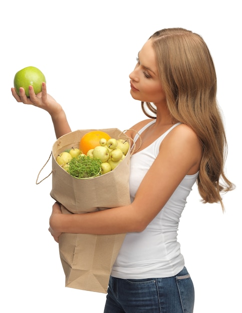 picture of woman with shopping bag full of fruits