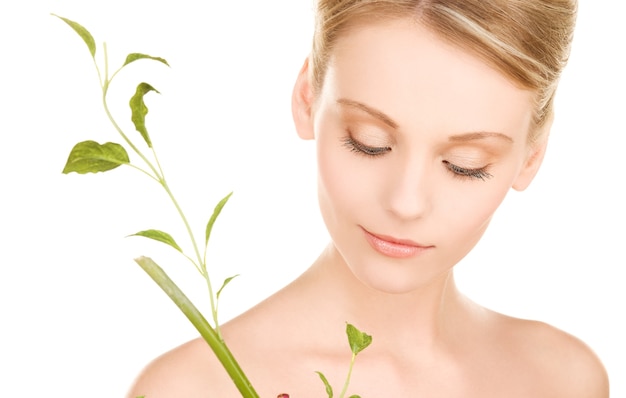 picture of woman with sprout over white