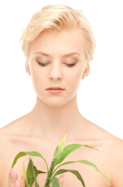 picture of woman with sprout over white