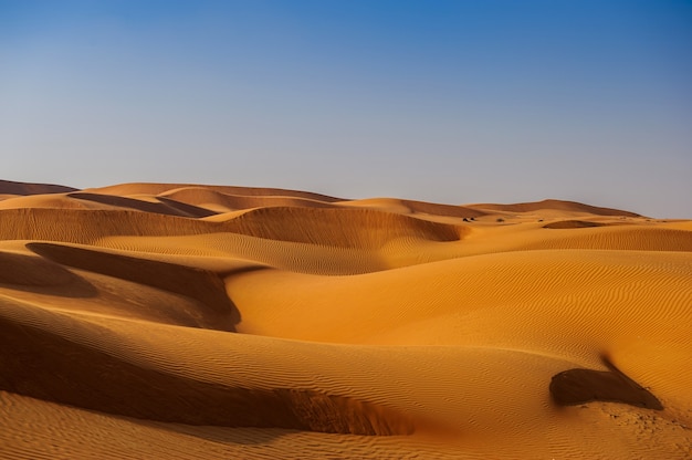 Premium Photo | Picture of yellow desert in front of blue sky