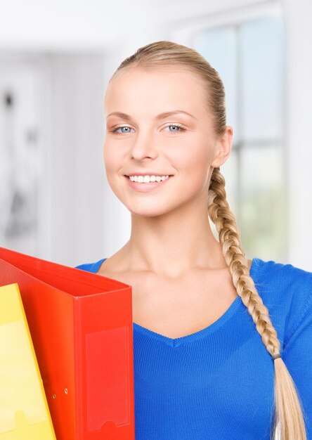 picture of a young attractive businesswoman with folders