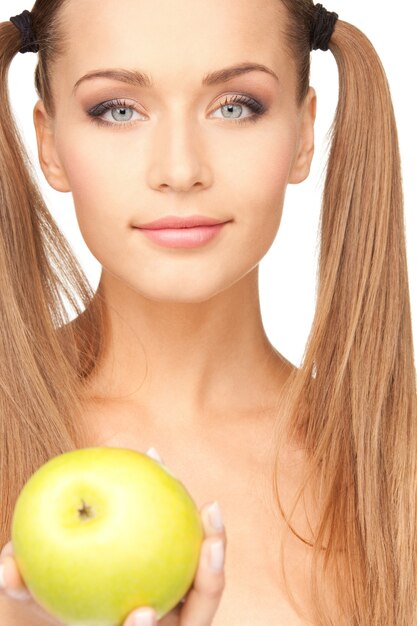 picture of young beautiful woman with green apple