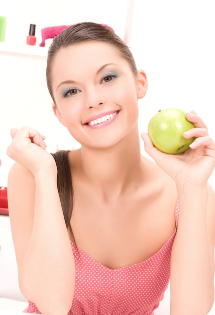 picture of young beautiful woman with green apple