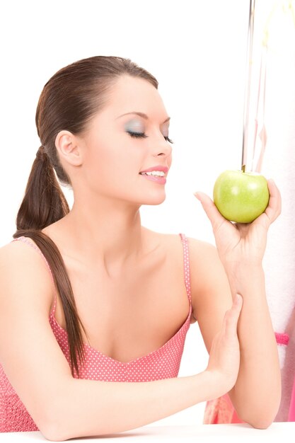 picture of young beautiful woman with green apple