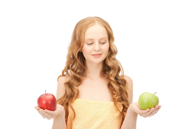 picture of young beautiful woman with green and red apples