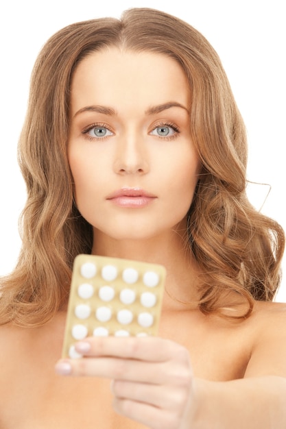 picture of young beautiful woman with pills