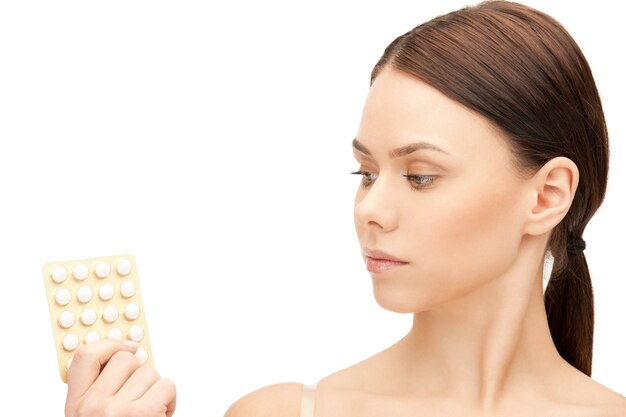 picture of young beautiful woman with pills