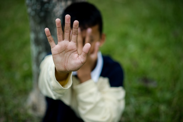 Picture of a young boy sitting sad Stop violence against children Depression concept