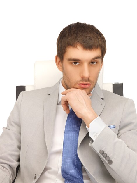 picture of young businessman sitting in chair