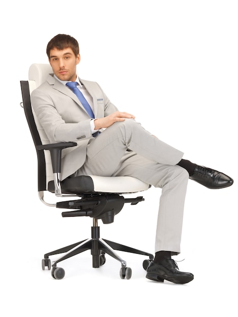 picture of young businessman sitting in chair