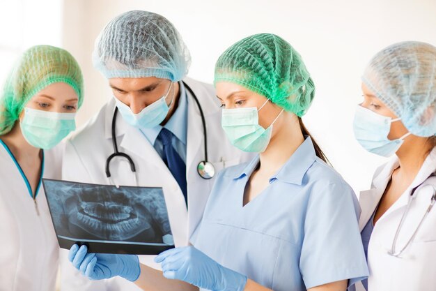 picture of young group of doctors looking at x-ray