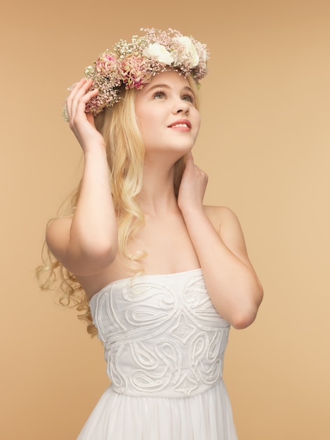 picture of young woman wearing wreath of flowers