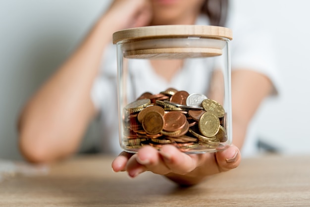 Pictures of hands and money of businessmen on the desk. Saving ideas with copy space.