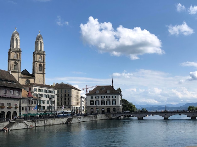 Picturesque City panorama with Grossmünster cathedral, lake and quay, Zurich, Switzerland