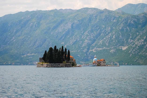 The picturesque island in the blue sea