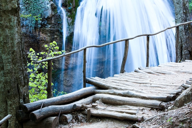 Picturesque landscape of a waterfall in a forest in the Highlands