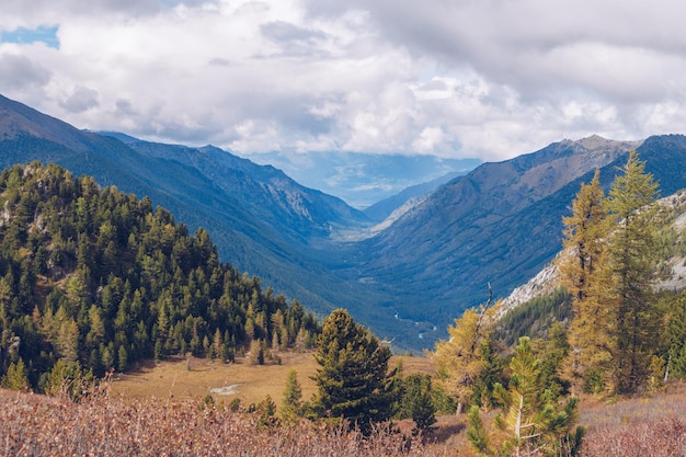 Picturesque marvelous view in the mountains Amazing mountain range valley scenic landscape among clouds and colorful hills Autumn season in the mountains stock photography