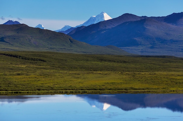 Picturesque Mountains of Alaska in summer. Snow covered massifs, glaciers and rocky peaks.