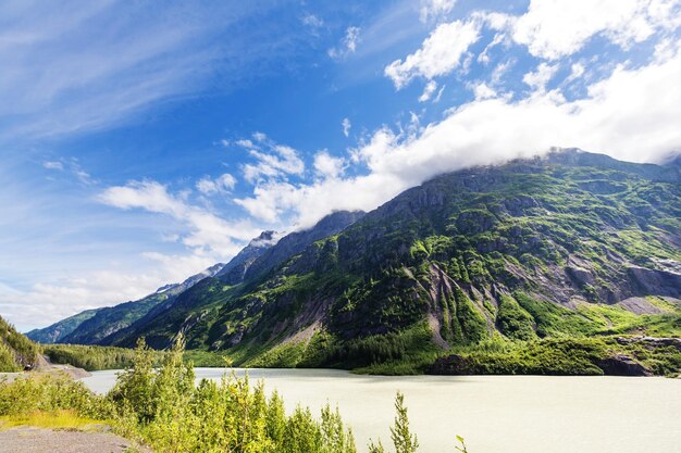 Picturesque Mountains of Alaska in summer. Snow covered massifs, glaciers and rocky peaks.