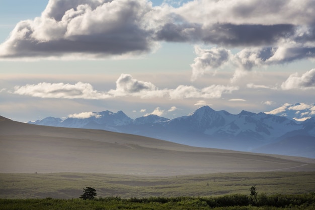 Picturesque Mountains of Alaska in summer. Snow covered massifs, glaciers and rocky peaks.