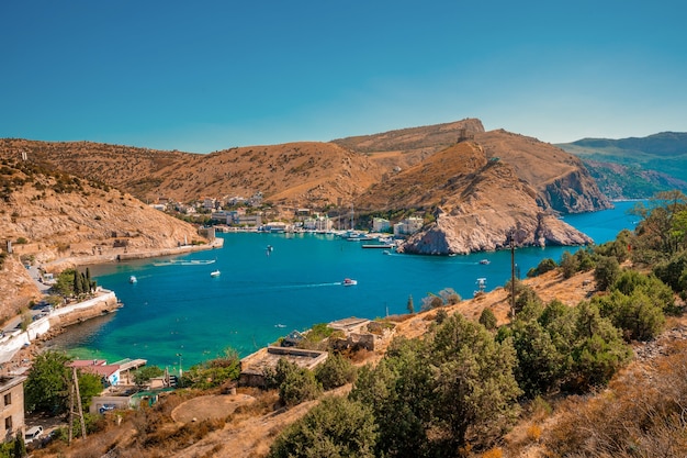 Picturesque panoramic view of Balaklava bay with yachts and green hills. Sevastopol, Crimea.