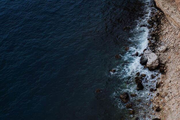 Picturesque seascape with rocky cliffs stones sea bay