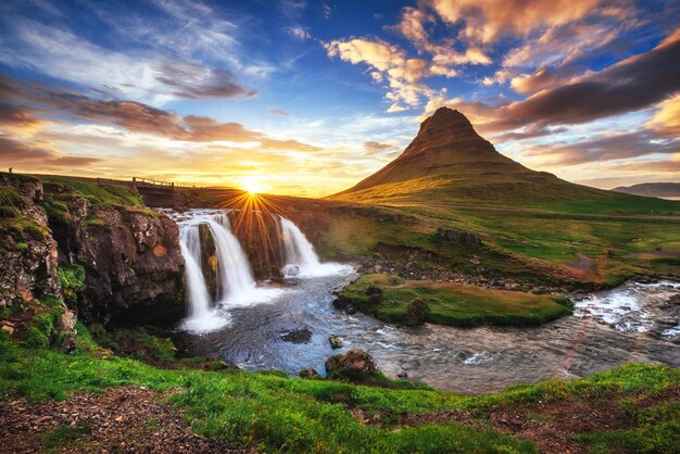 Photo the picturesque sunset over landscapes and waterfalls kirkjufel