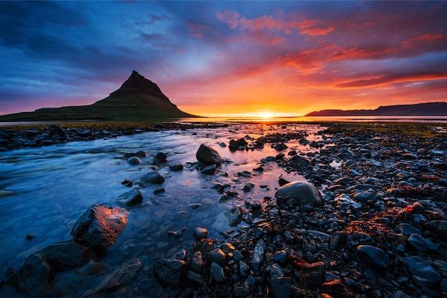 The picturesque sunset over landscapes and waterfalls.