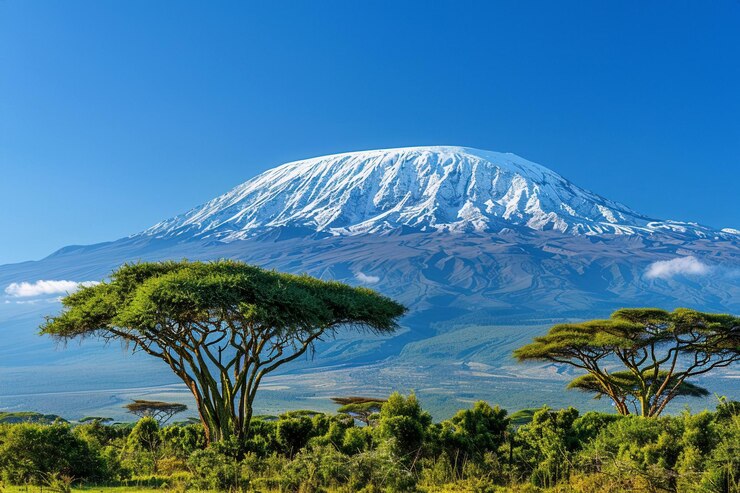 Photo a picturesque view of the mount kilimanjaro in tanzania with its snowcapped peak against a clear blue sky
