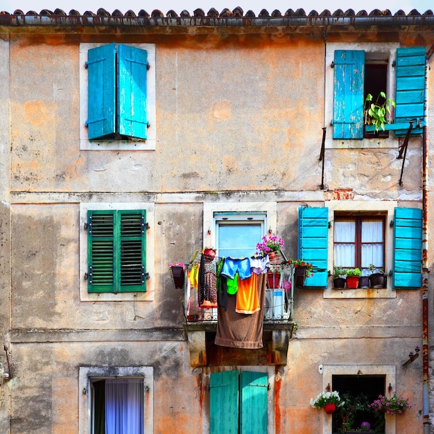 Picturesque wall of old house with balcony