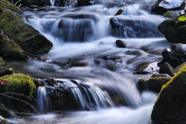 Picturesque waterfall in the autumn forest