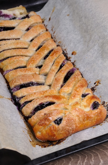 Pie stuffed with cheese cream , blueberry, crushed peanuts braided plait