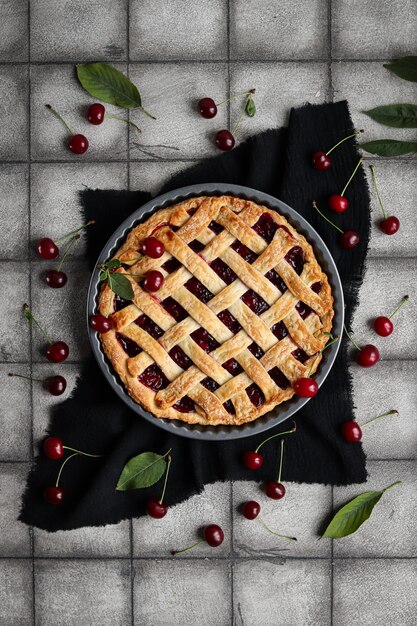 Pie with berries and cranberries on a black cloth