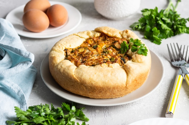 Pie with cabbage, eggs and parsley filling