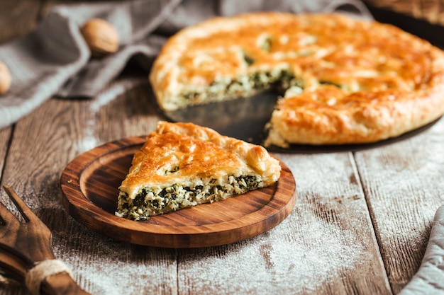 Pie with spinach and cheese filling