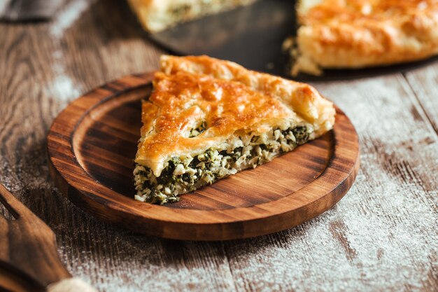 Pie with spinach and cheese filling