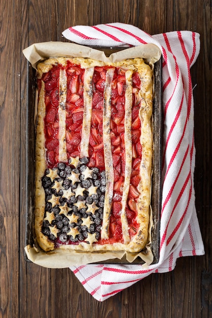 Pie with strawberries and blueberries American flag. 4th of July. US Independence Day