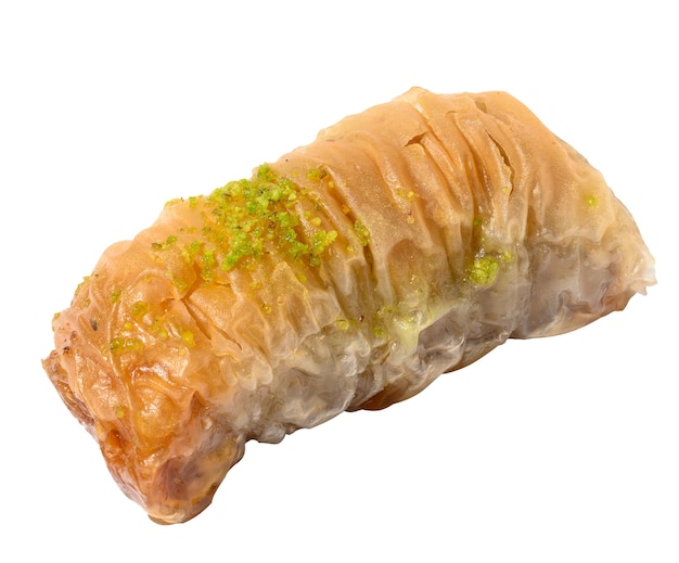 A piece of baked baklava in honey on a white isolated background