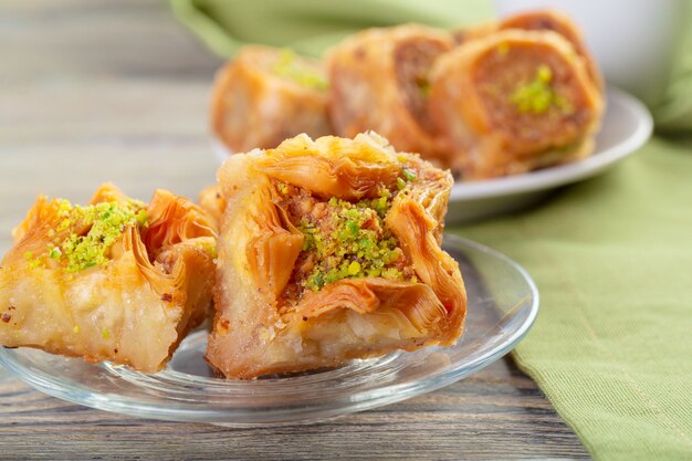 A piece of baklawa on a  plate on a table