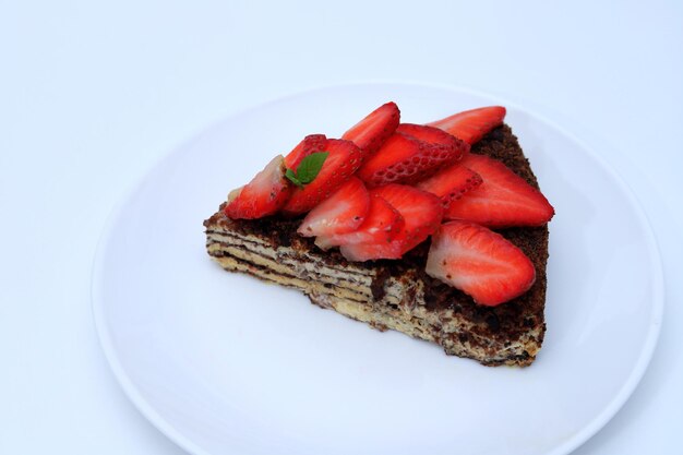 Piece of cake with strawberry closeup