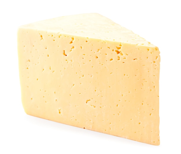 A piece of cheese close-up on a white. Isolated