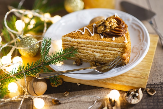 A piece of Christmas cake on the wooden table